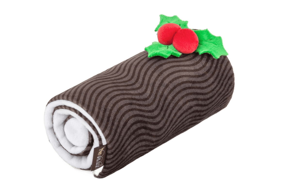 Christmas Yule Log shaped plush dog toy, cut out on a transparent background